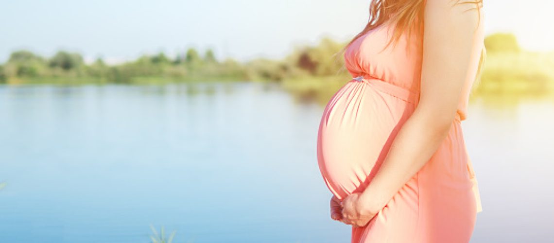 Young happy pregnant couple